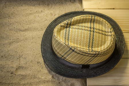 Shot to a few wooden planks, sand and a few summer clothing articlesの写真素材