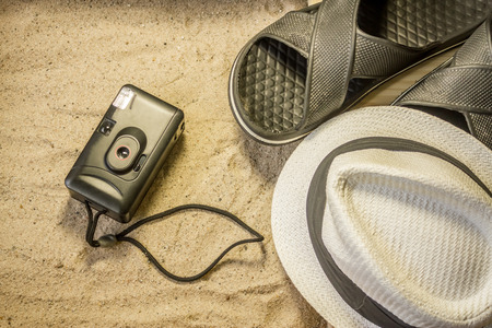 Shot to a few wooden planks, sand and a few summer clothing articlesの写真素材