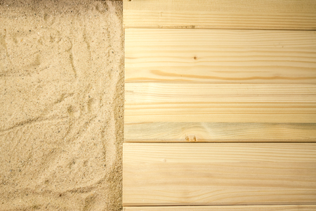 Summer beach backround made from some wooden planks and sandの写真素材