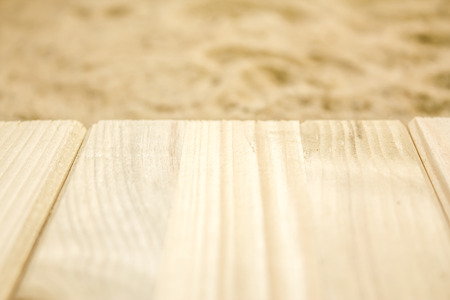 Summer beach backround made from some wooden planks and sandの写真素材