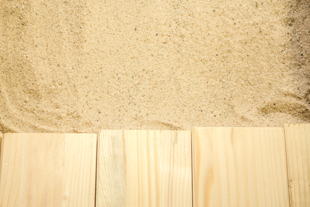 Summer beach backround made from some wooden planks and sandの写真素材