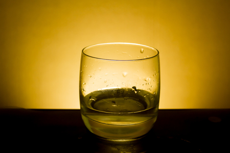 Elegant shot of a  glass of water on a dark backgroundの写真素材