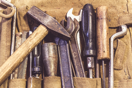 Assorted mixed work tools in their bagの写真素材