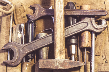 Assorted mixed work tools in their bagの写真素材