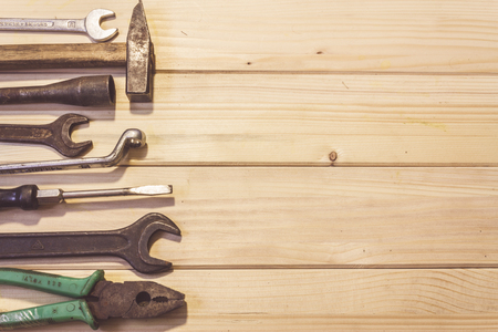Assorted mixed work tools on woodの写真素材
