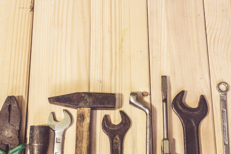 Assorted mixed work tools on woodの写真素材