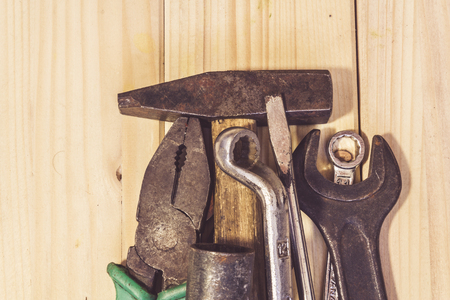 Assorted mixed work tools on woodの写真素材