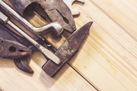 Assorted mixed work tools on woodの写真素材