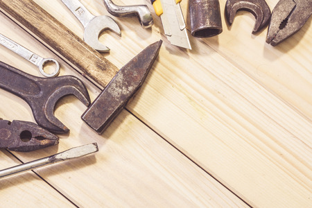 Assorted mixed work tools on woodの写真素材