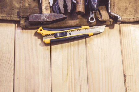 Assorted mixed work tools on woodの写真素材