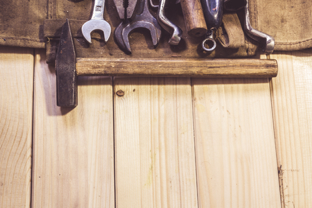 Assorted mixed work tools on woodの写真素材
