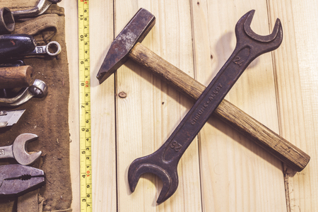 Assorted mixed work tools on woodの写真素材