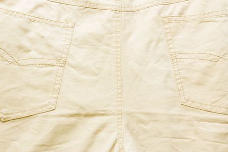 Denim texture, beige jeans backgroundの写真素材