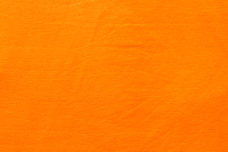 Orange fabric background close up made to shirtの写真素材