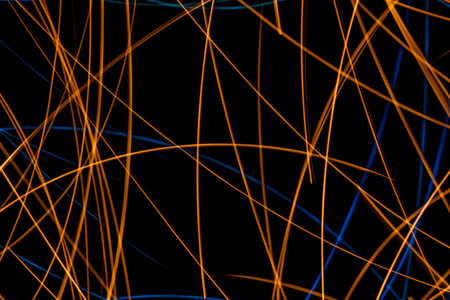 Abstract background made with long exposure settings to blue and yellow lights