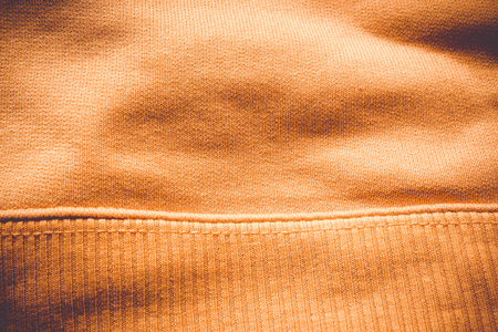 Close-up to fabric of a orange blouseの写真素材