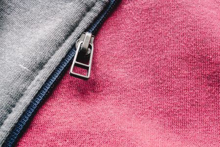 Close up to zipper on sports wear. Athletic cloth background
