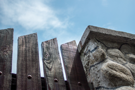 stone and wood fence design model on a cloudy dayの写真素材