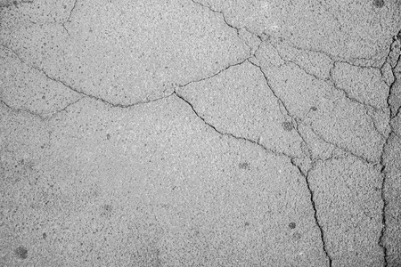Close-up to cracked asphalt with textureの写真素材