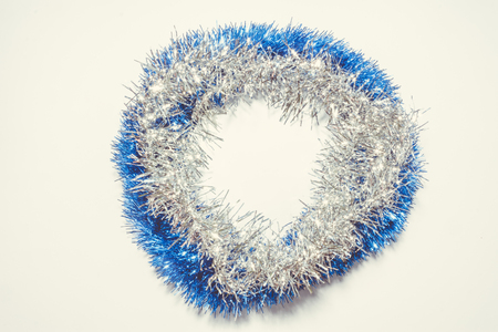 Christmas background with blue and silver decoration on green pine leaves. Round copy space for textの写真素材