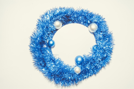 X-mas background with blue decoration, christmas balls and green pine leaves. Round copy space for textの写真素材