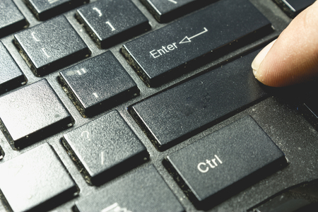 Finger pressing blank button on dirty keyboardの写真素材
