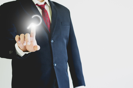 Businessman pressing search icon in the airの写真素材