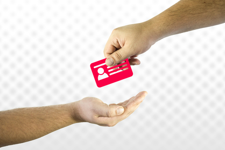 Hand giving id card icon to another. Help or assistance in online shopping issues conceptの写真素材