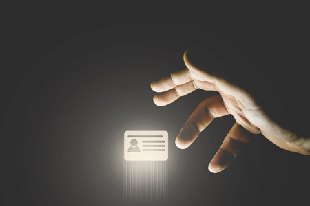 Hand stealing id card icon. Hacking credit cards conceptの写真素材
