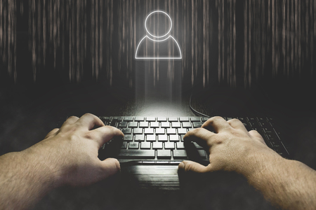 Hand typing on keyboard with user icon. Hacking social account concept illustrationの写真素材