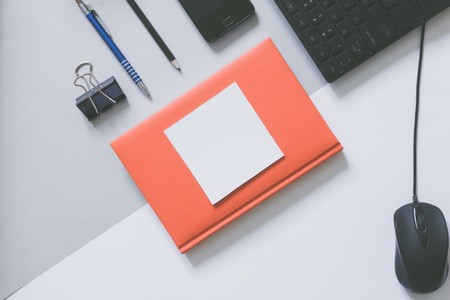 Top view of blank frame on pastel. Colored background office desk with different objects. Minimal flat lay styleの写真素材