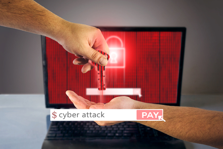 Male hand giving a crypted key to another. Red locked padlock on a screen with binary code. Hacking concept backgroundの写真素材