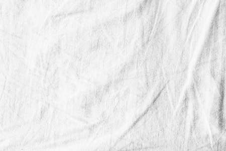 White background of crumpled sheet fabric textureの写真素材
