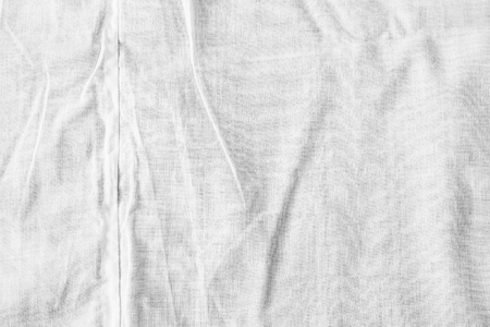 White background of crumpled sheet fabric textureの写真素材