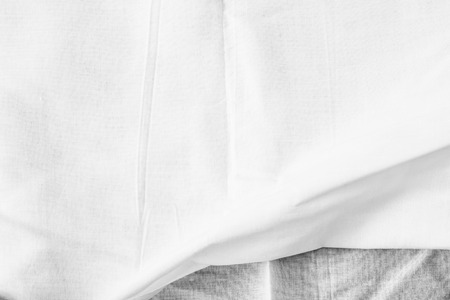 White background of crumpled sheet fabric textureの写真素材