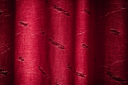 Background of a closed red crumpled curtainの写真素材