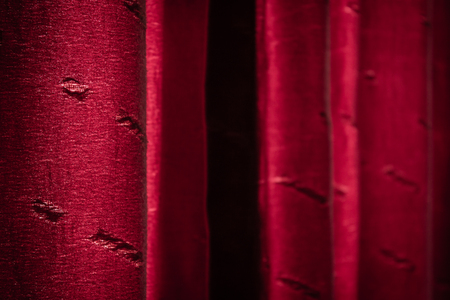 Background of a closed red crumpled curtainの写真素材