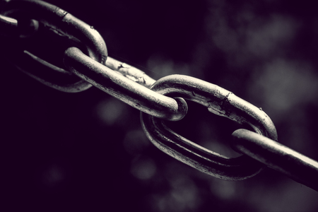 Stainless steel chain links. Industrial metal background