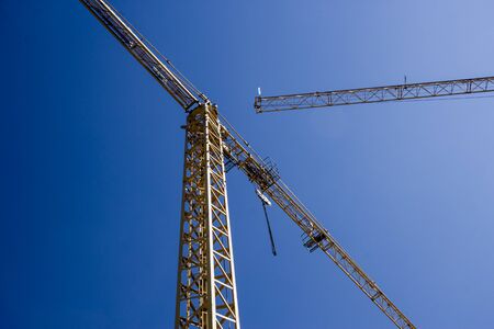 Crane lifted in the sky on a construction site