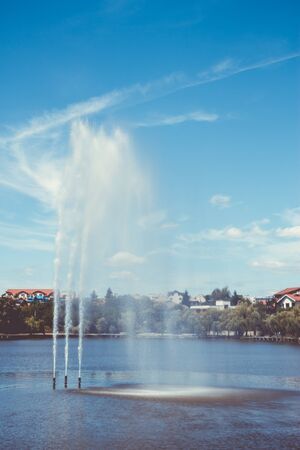 Fountain on a lake. Magazine cover conceptの写真素材