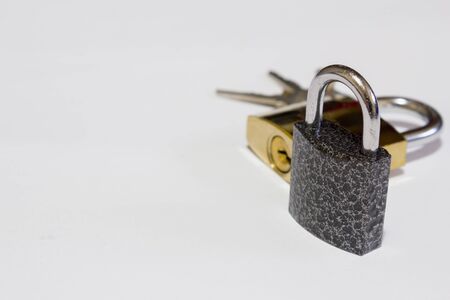 Locked padlocks and keys on white background. Safety concept imageの写真素材