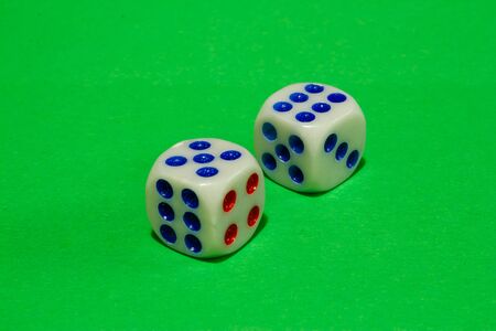 Isometric shot of two dices on green background. Casino gambling concept imageの写真素材