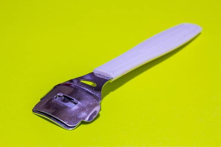 Perspective view of a callus remover with a metallic head and a plastic bodyの写真素材