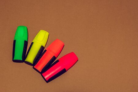 Awesome school or business concept of a few arranged colored markers in a round orderの写真素材
