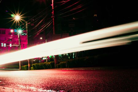 Night time abstract background â€“ Concept of a busy city â€“ Long exposure of bright...