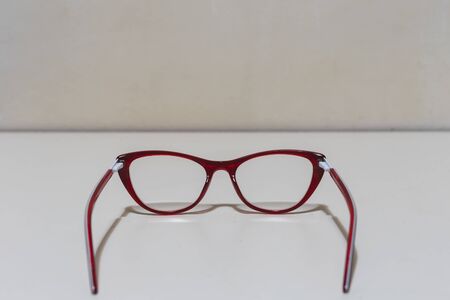 Modern eyeglasses placed on white background with copy space â Fashionable optical accessory for improving eyesightの写真素材