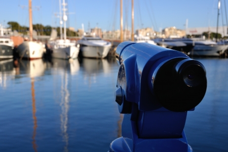Touristic Telescope pointed at the Yachts of Barcelona Port, Spainの写真素材