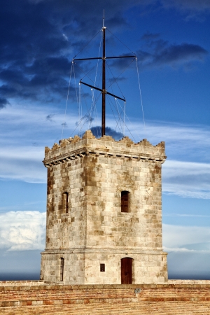 Tower of Castle of Montjuic, Barcelona, Spain with Heavy cloudsの写真素材