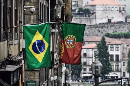 Brazil and Portugal flags at Porto street, Portugalの写真素材
