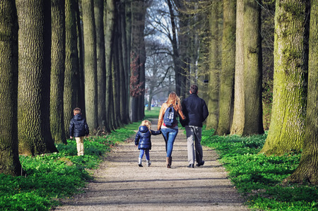 UTRECHT, NETHERLANDS - MARCH 15, 2014  Family walking down the pathway at beautiful garden of De Haar Castle in spring  The park is designed by Hendrik Copijn and has many waterworks and gardens のeditorial素材